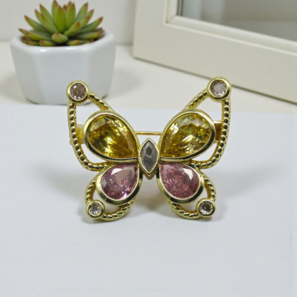 Broșă "Pastel Sunrise" – Fluture Auriu cu Cristale Galbene și Roz